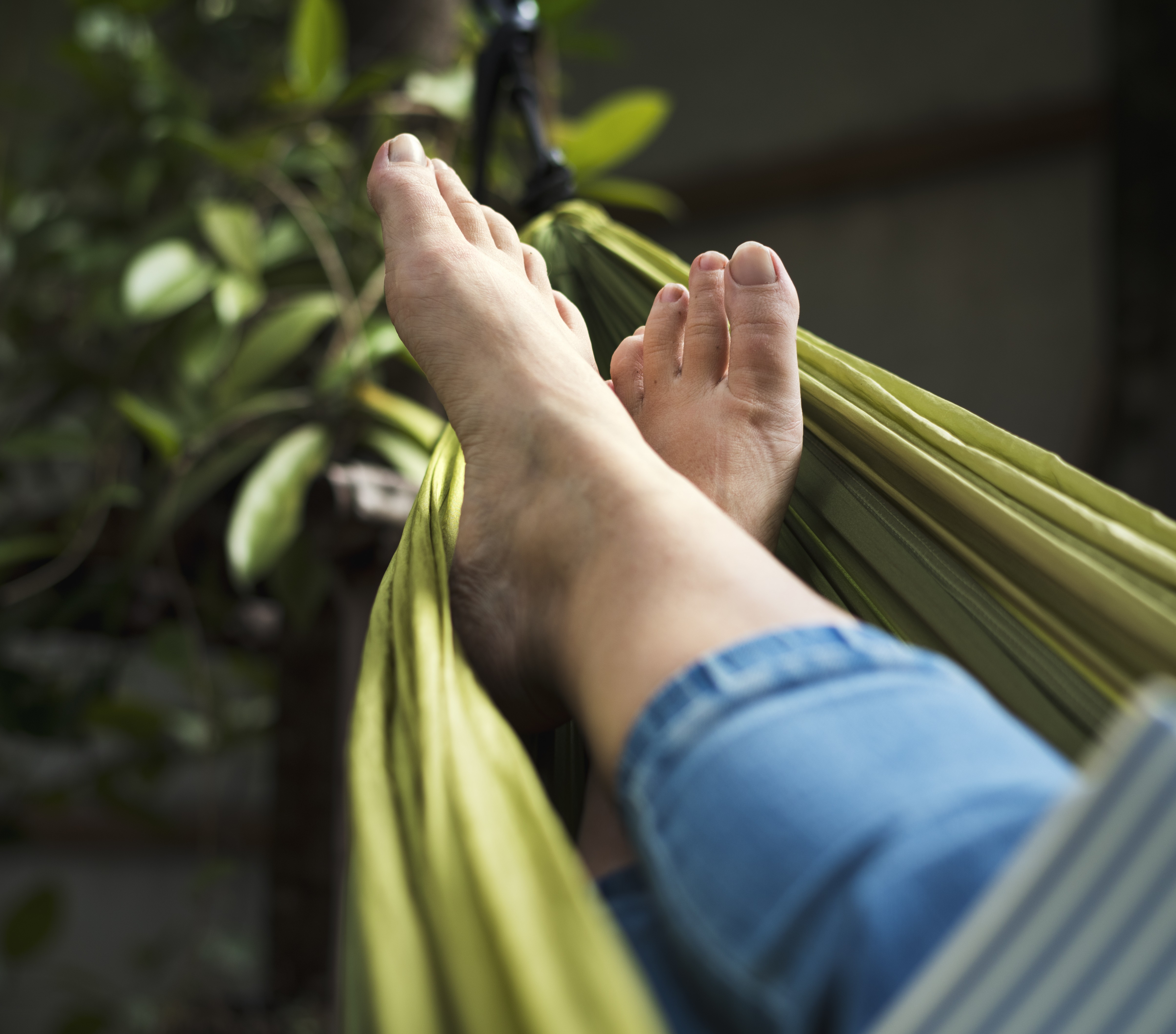 Person enjoying healthy nails and feet